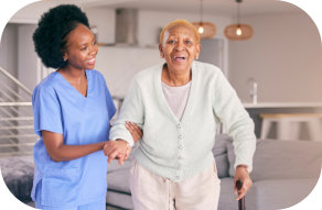 Caretaker helping an elderly woman