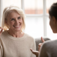 elderly woman make hand gesture