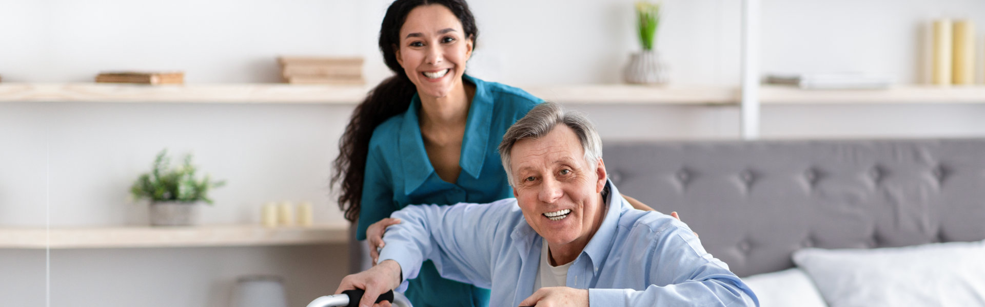 Carertaker helping an elderly man