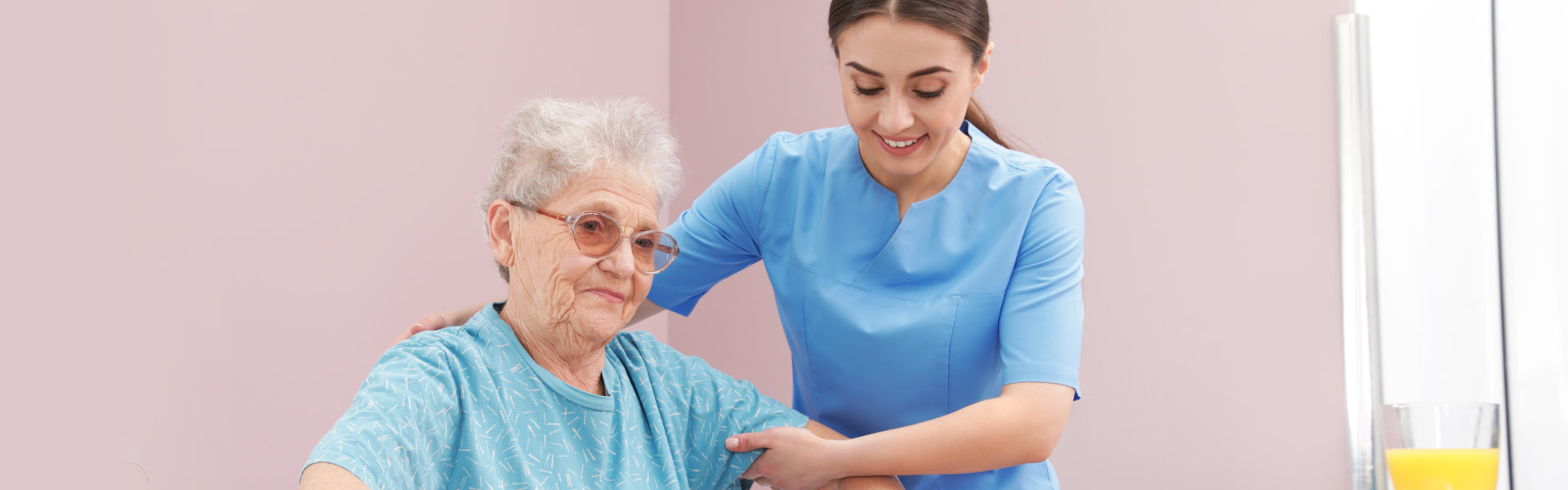 caregiver assessing the elderly woman